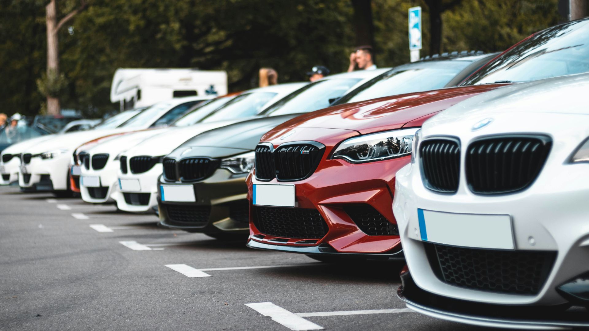 white and red bmw m 3 on road during daytime