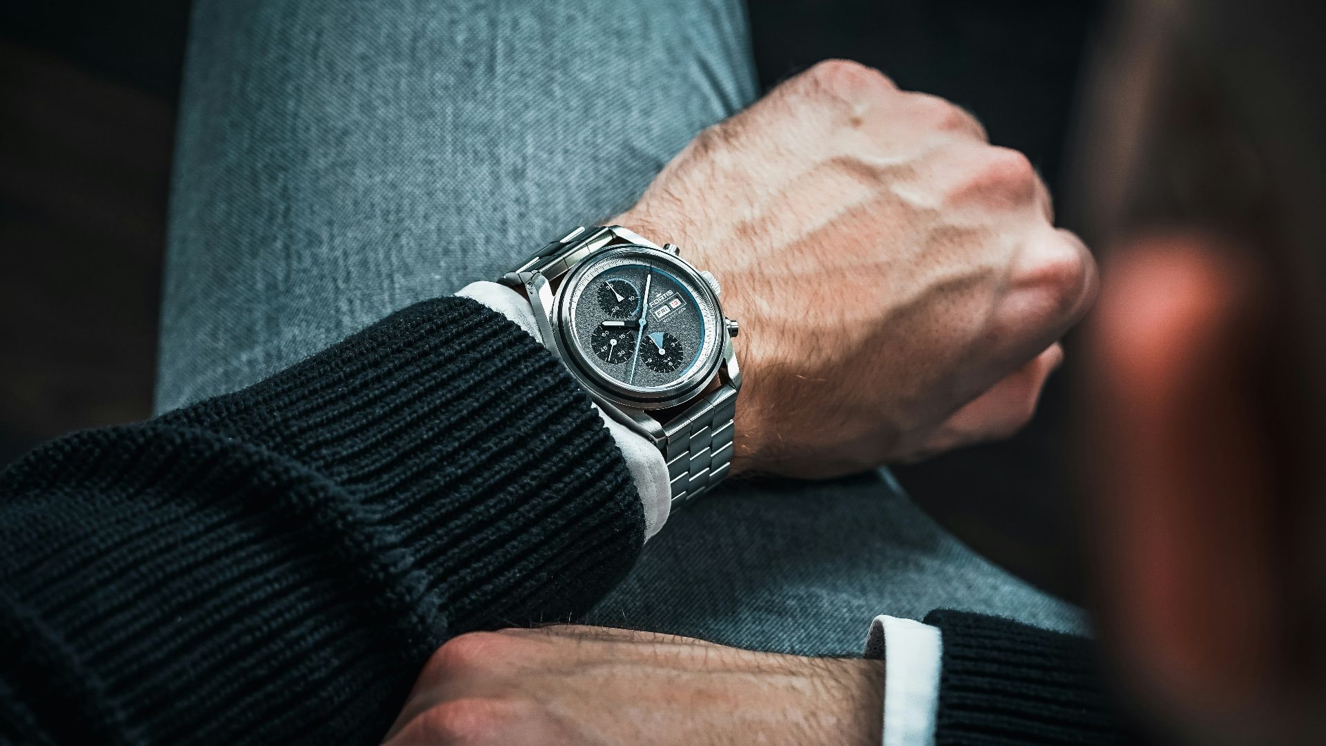 a close up of a person wearing a watch