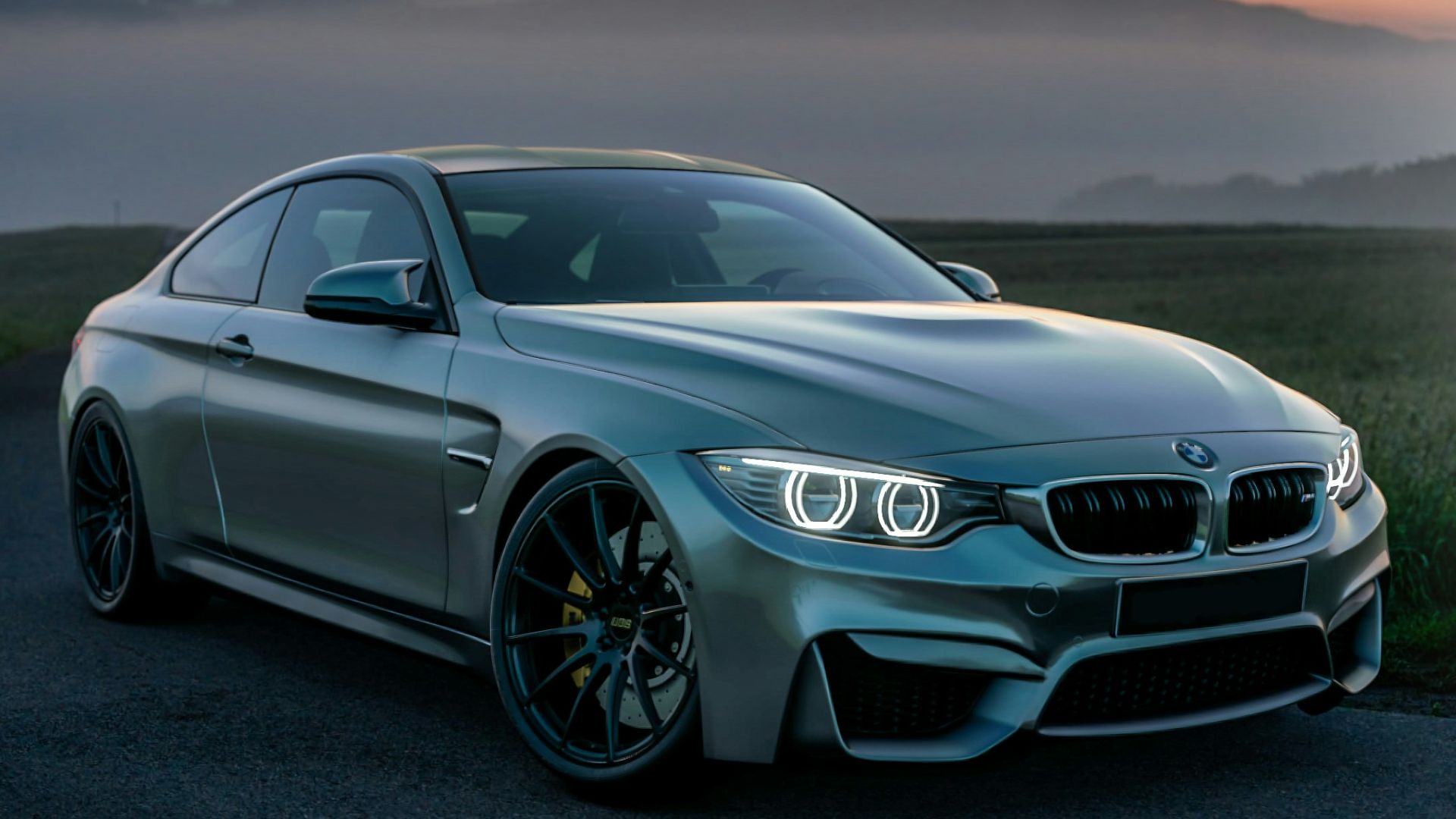 gray mercedes benz coupe on black asphalt road during daytime