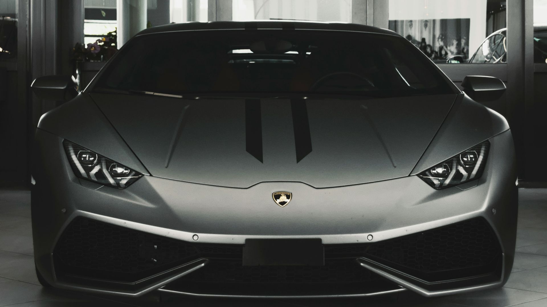 gray coupe on parking area