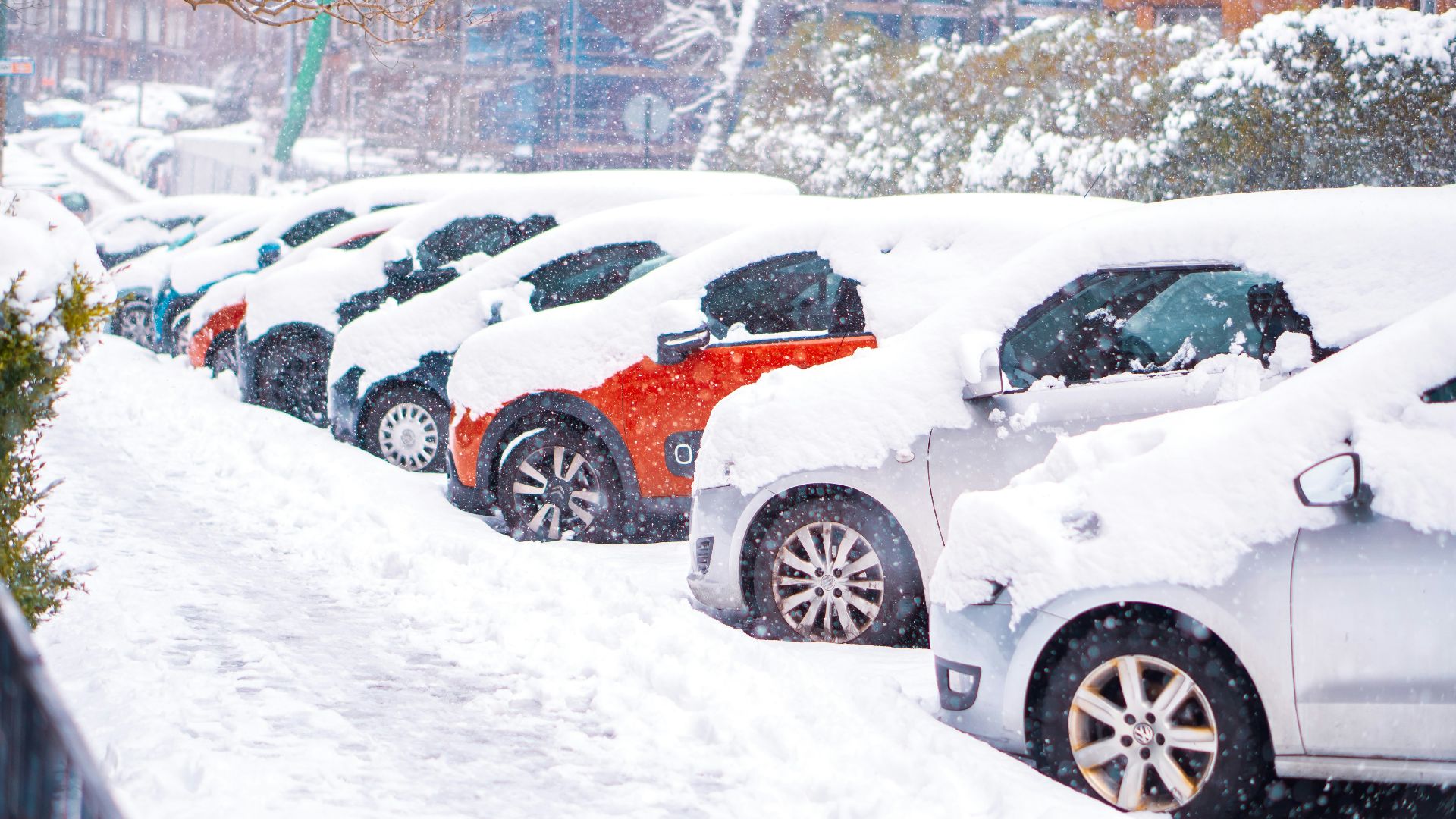 black suv covered with snow