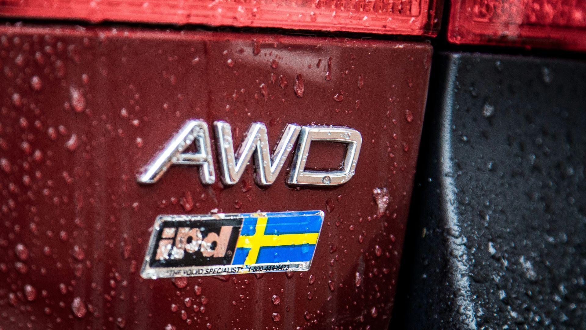 a close up of the emblem on a red car