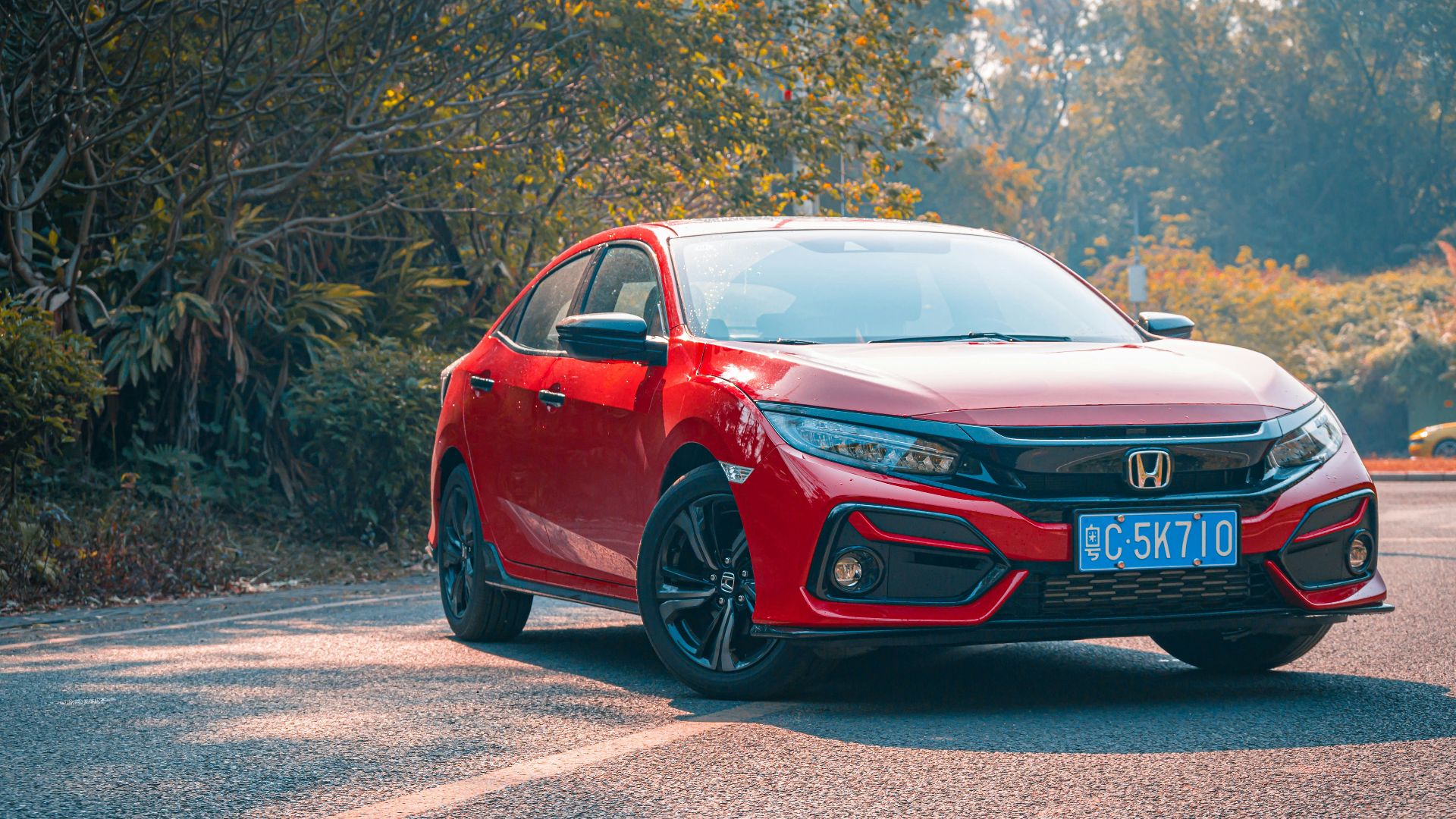 red audi r 8 on road during daytime