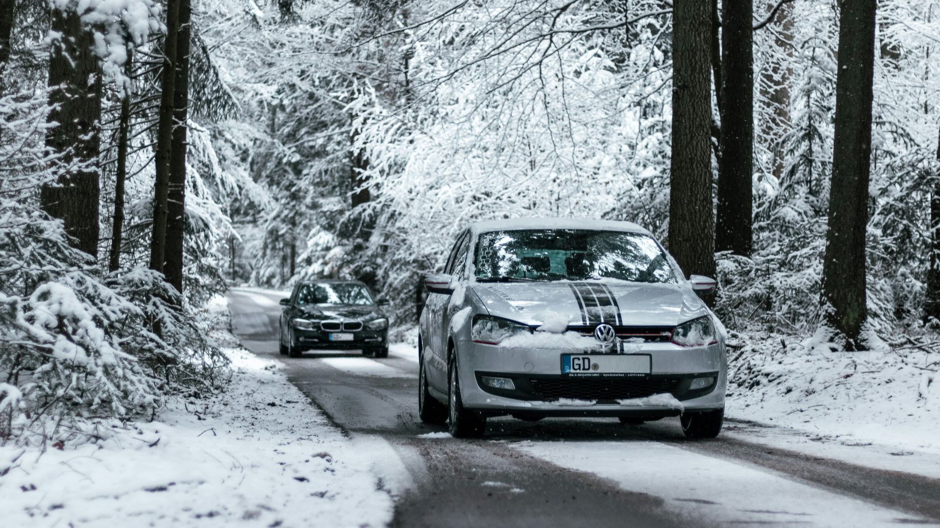 black bmw m 3 coupe on snow covered road during daytime
