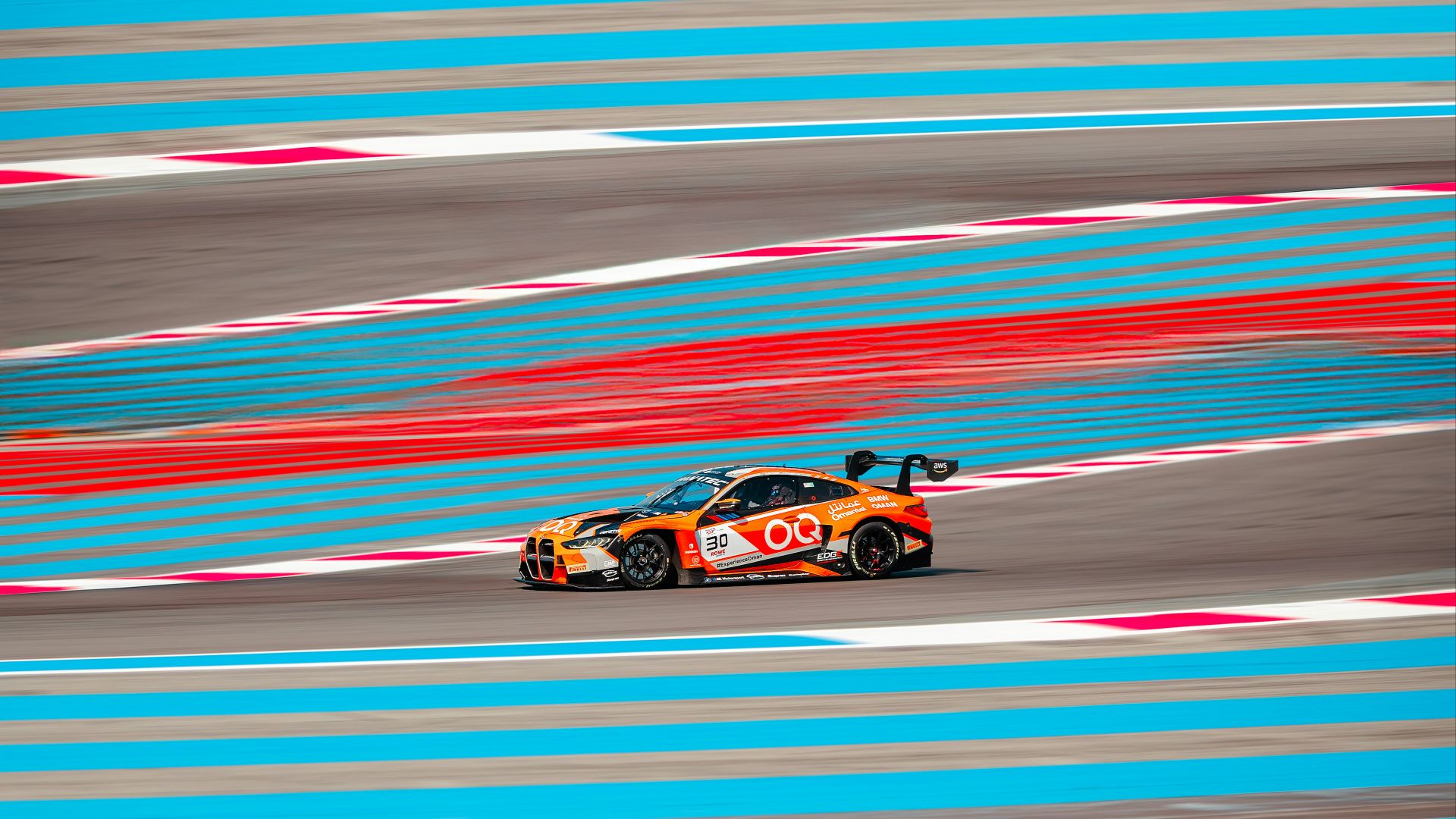 A car driving down a race track in motion