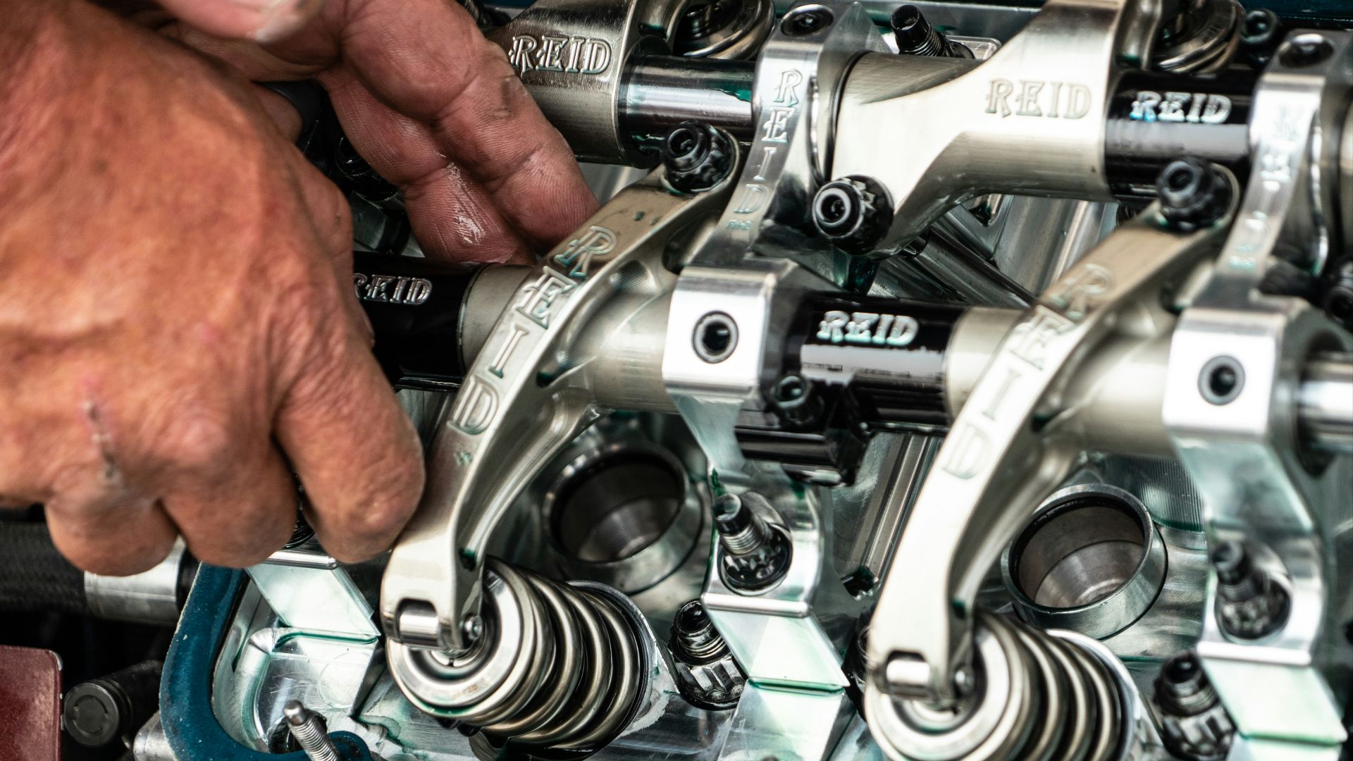 a close up of a person working on a machine