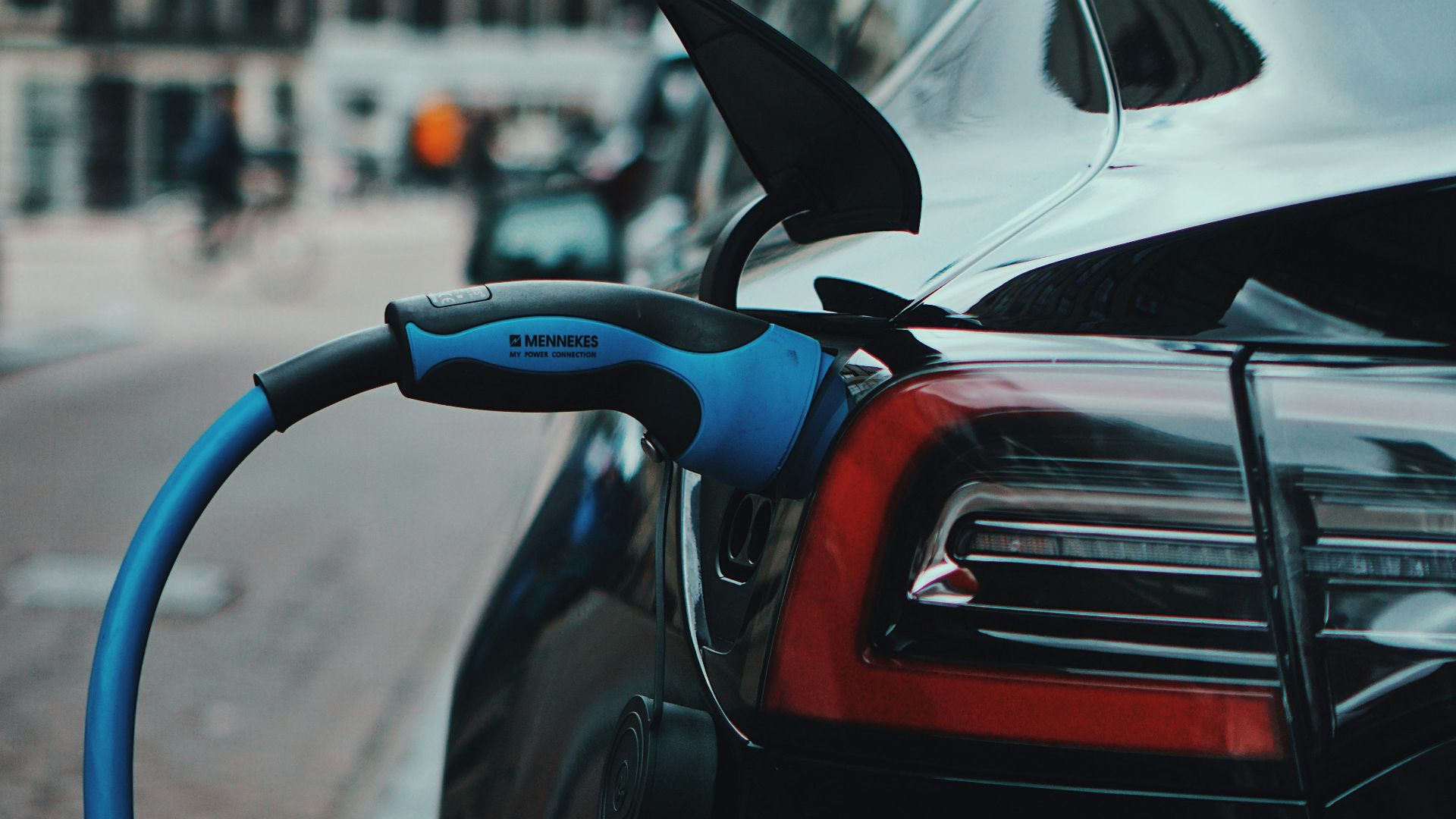 white and black car in front of white building during daytime