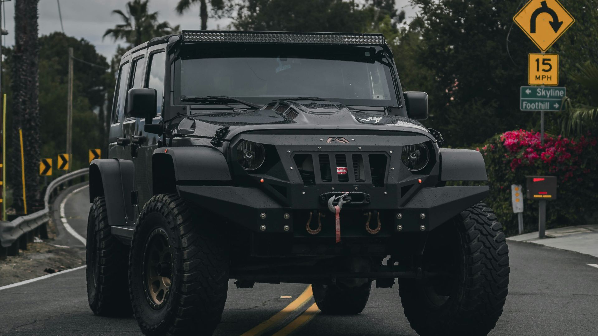 black jeep wrangler on road during daytime