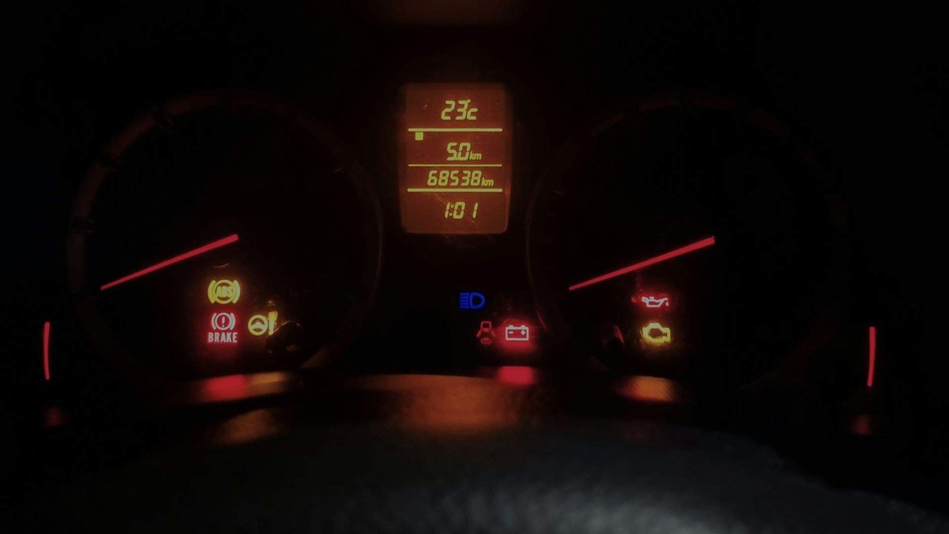 The dashboard of a car at night time