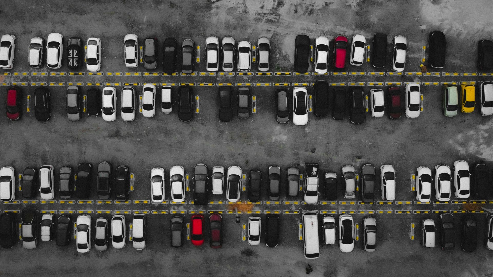 a parking lot filled with lots of parked cars