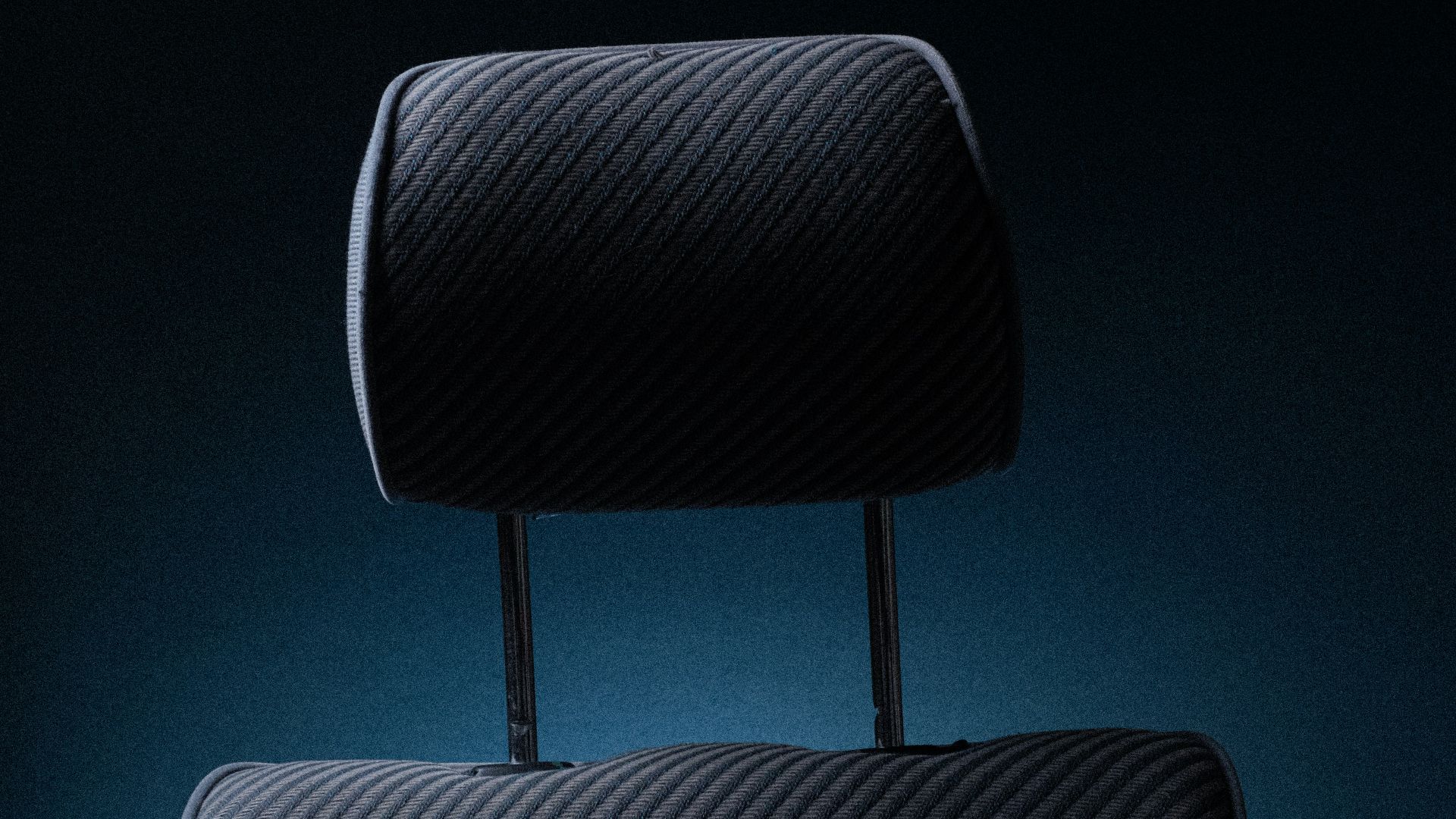 a black piece of luggage sitting on top of a chair