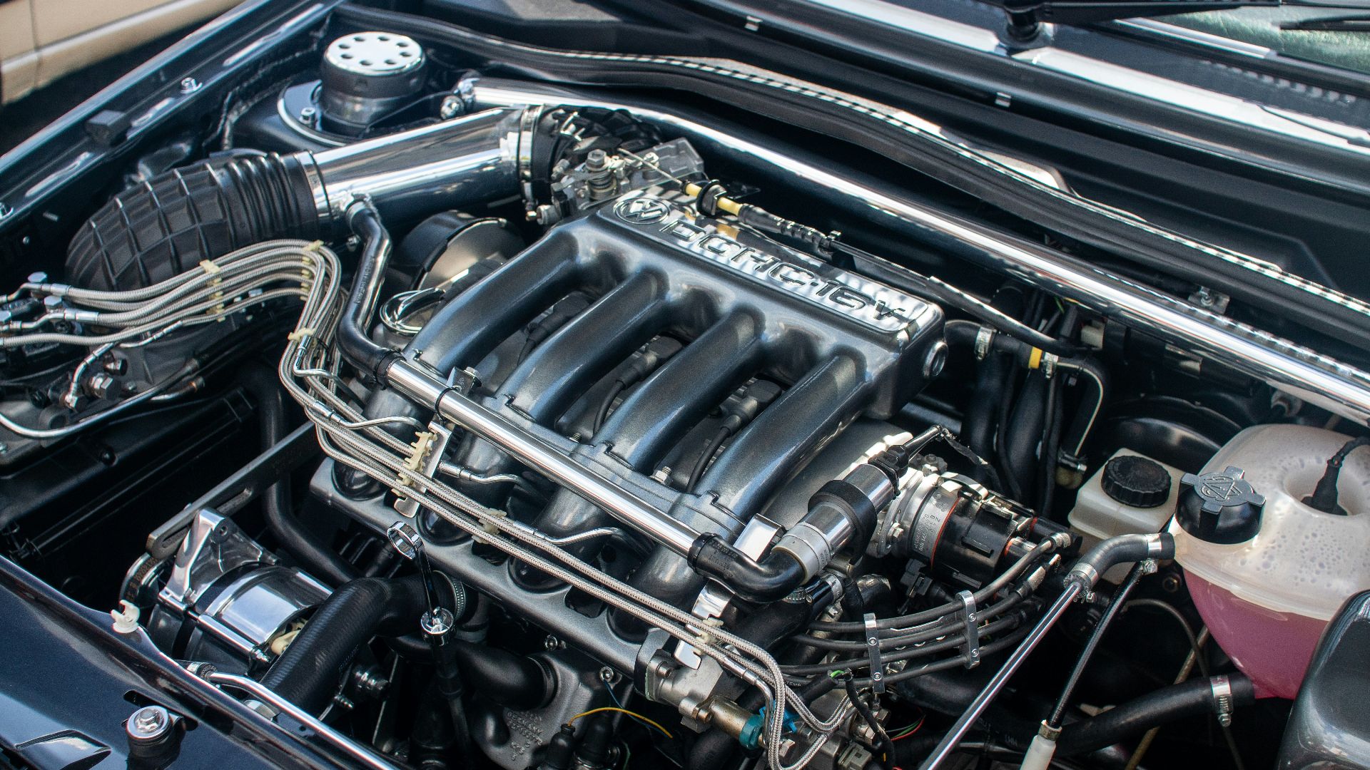 The engine compartment of a car with the hood up