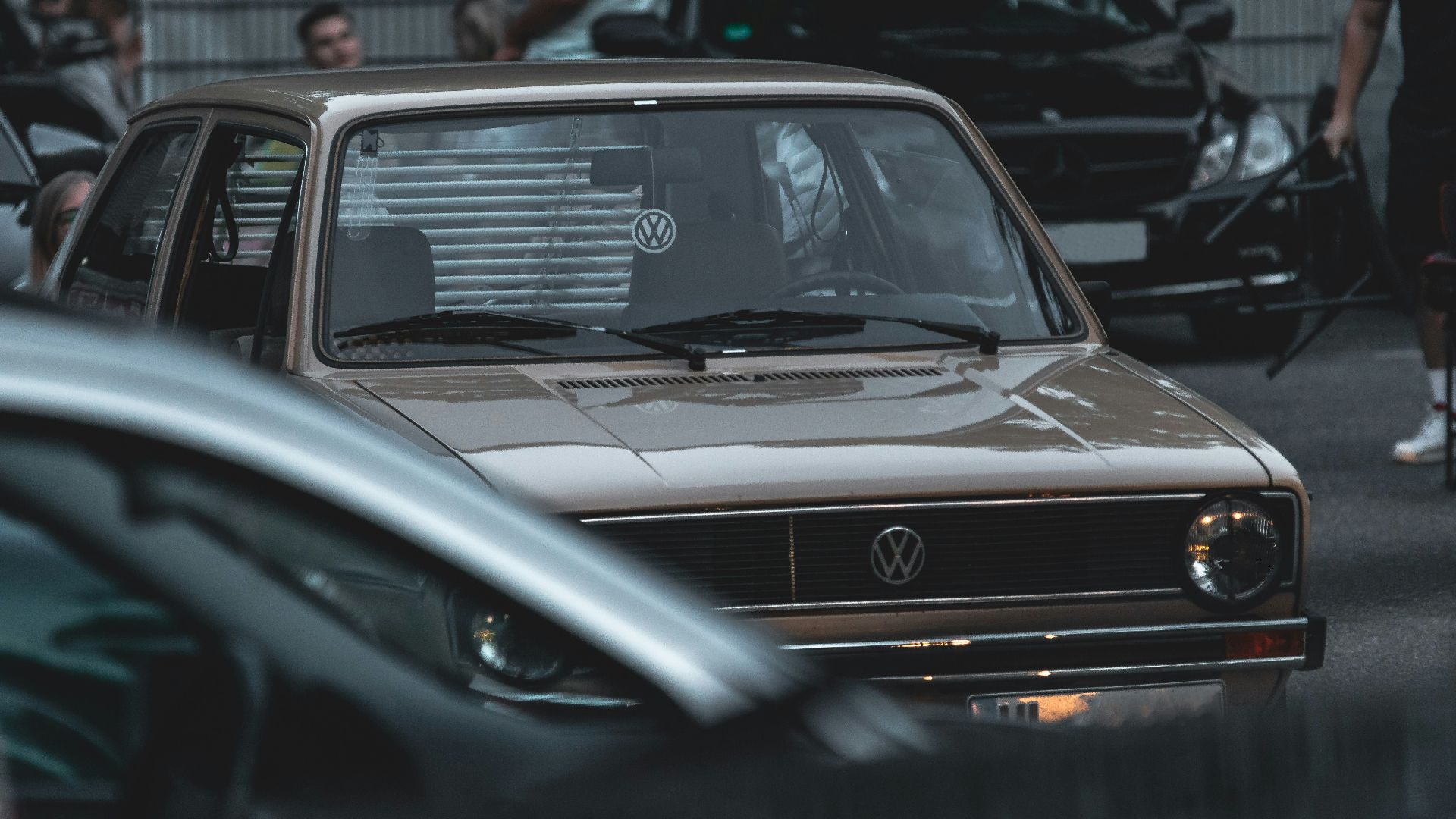 a group of cars parked next to each other in a parking lot