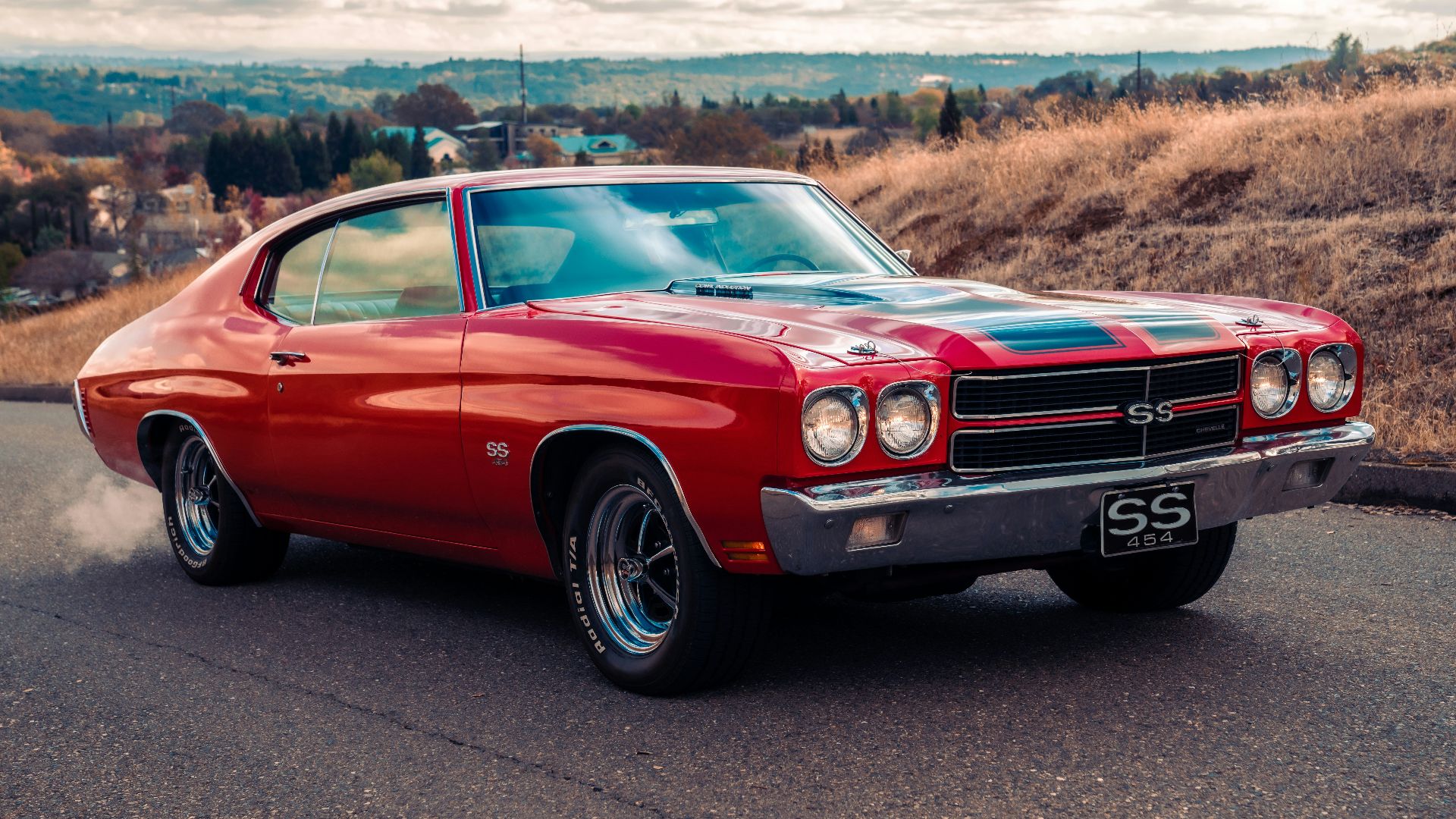red chevrolet camaro on road during daytime