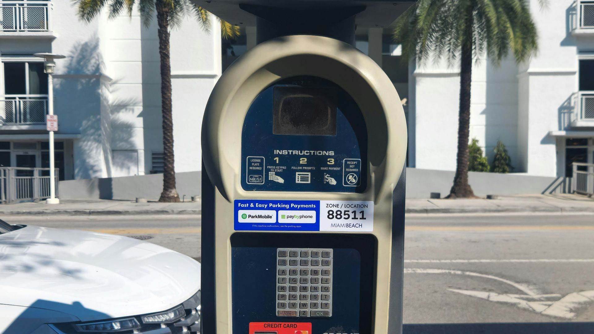A parking meter sitting on the side of a road