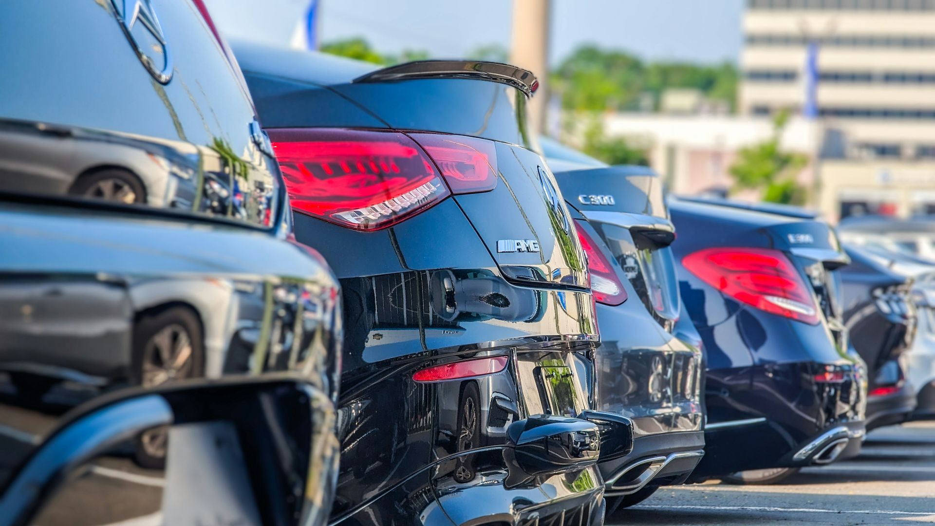 a row of parked cars in a parking lot