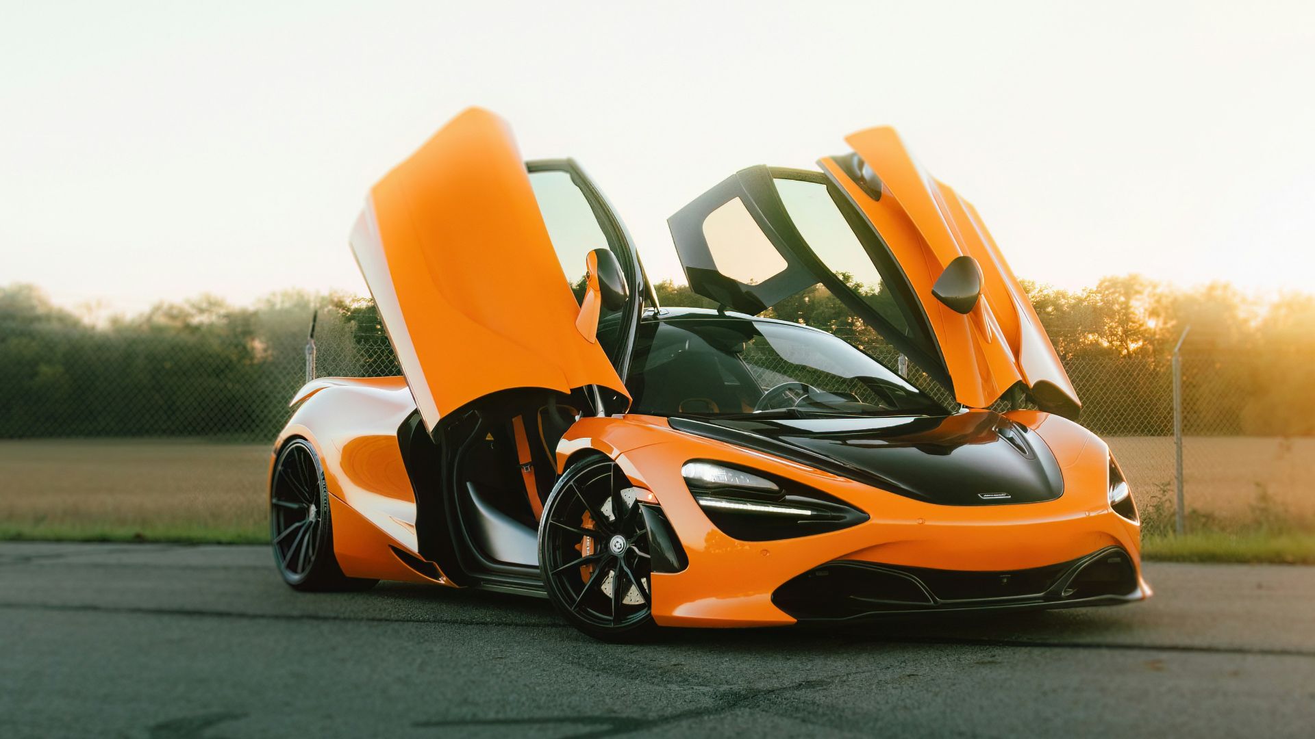A couple of cars that are sitting in the street