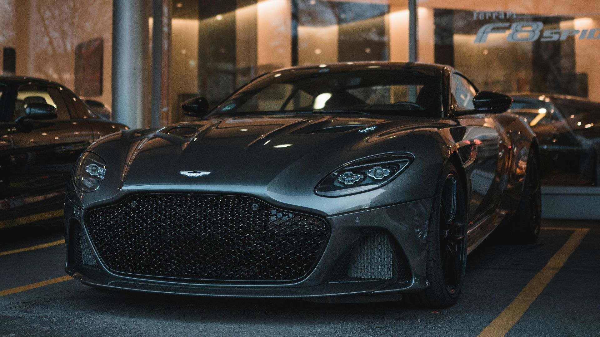 black porsche 911 parked in a parking lot