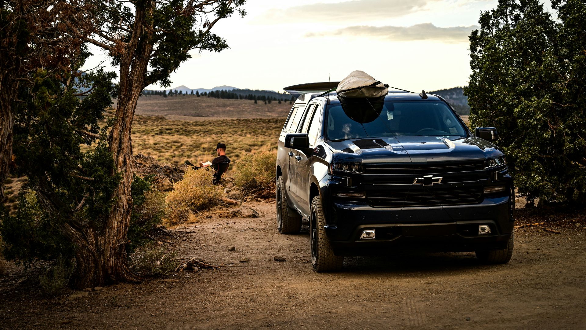 black suv on dirt road during daytime