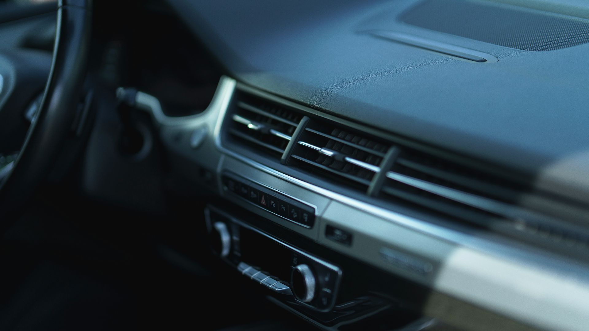 a close up of a steering wheel and dashboard of a car