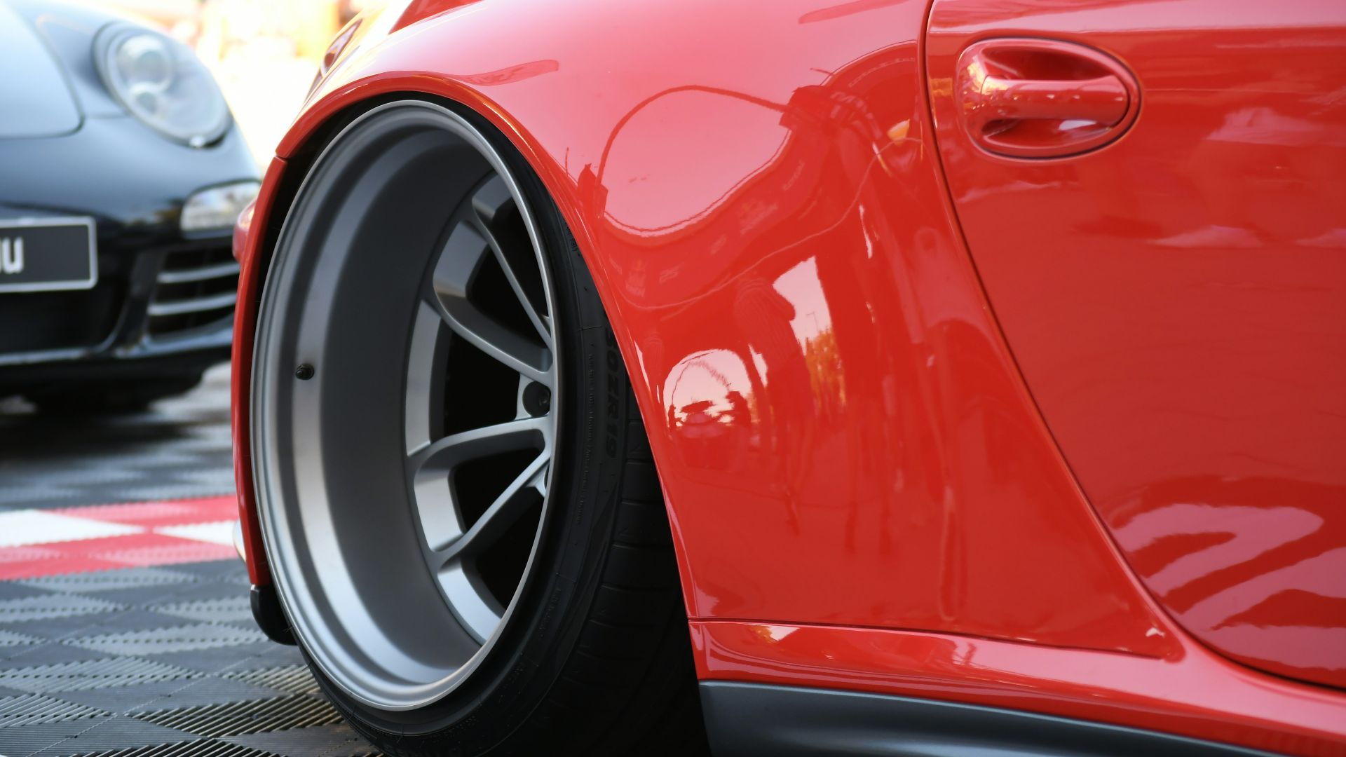 Red sports car with custom wheels
