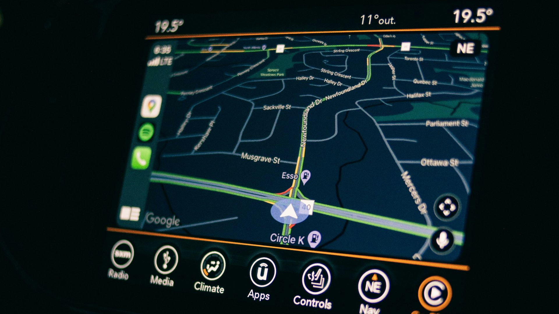 a car dashboard with a gps device in the middle of it