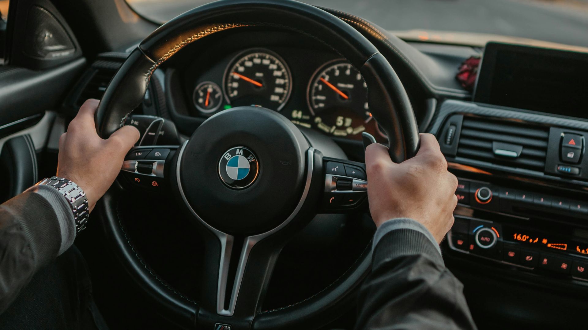 unknown person driving BMW car