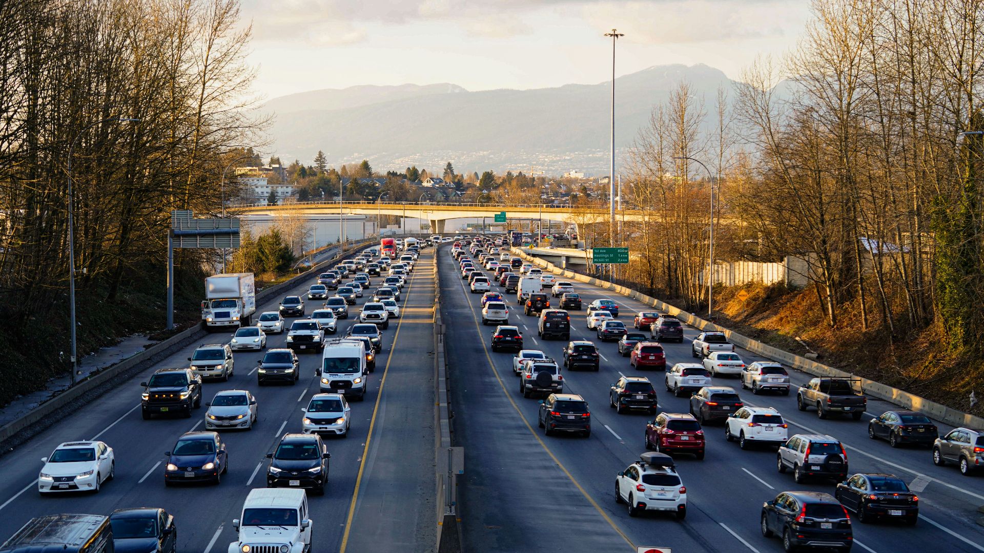 Highway is experiencing heavy traffic with many cars.