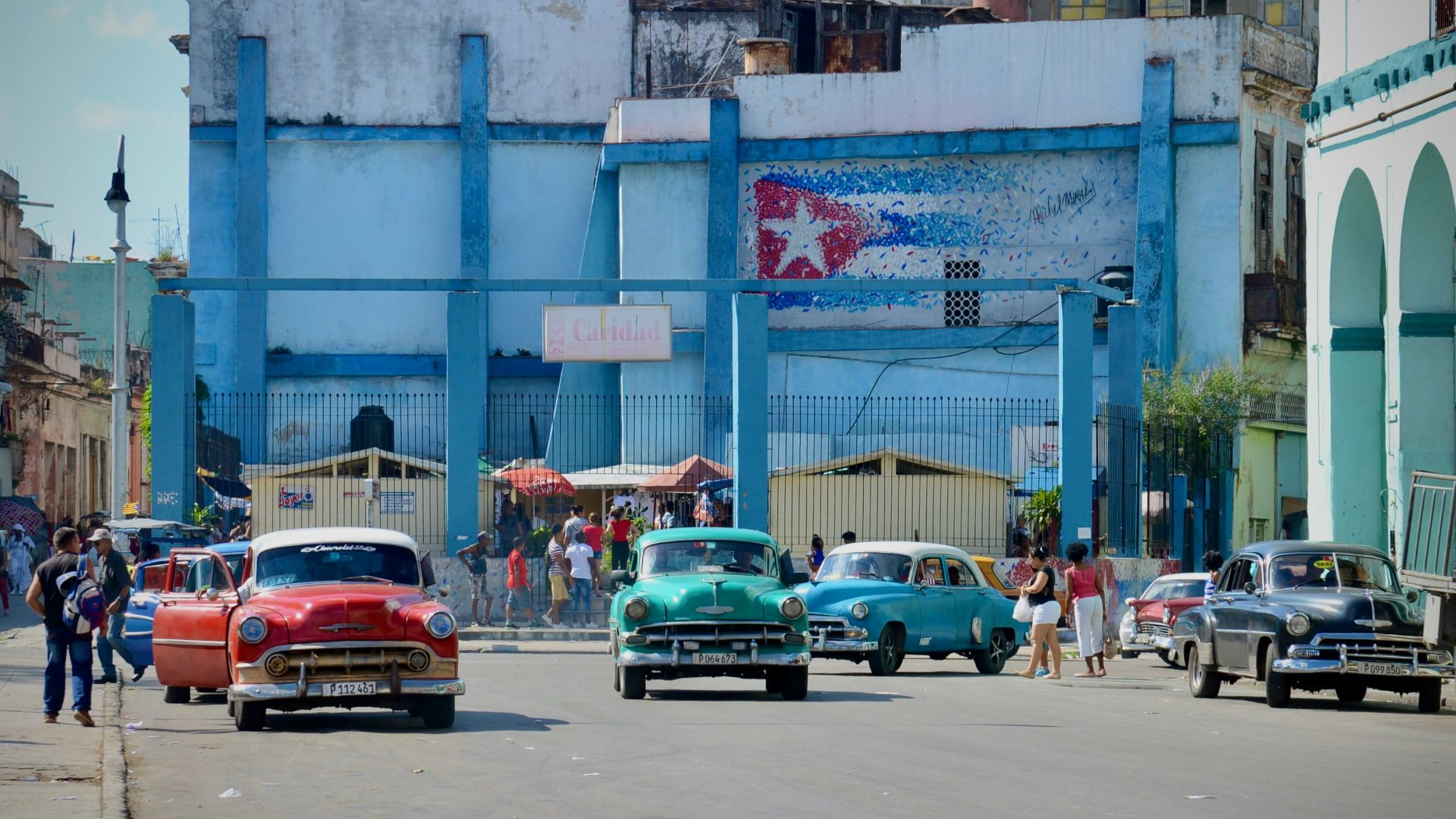 cars parked on street near building during daytime