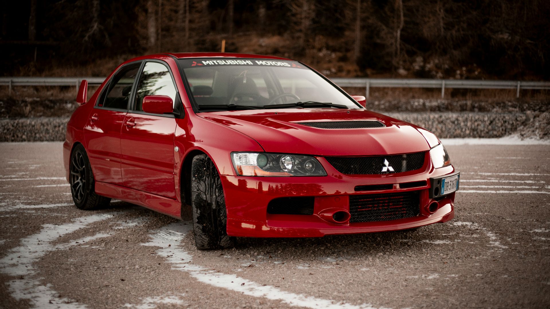 red chevrolet camaro on road during daytime
