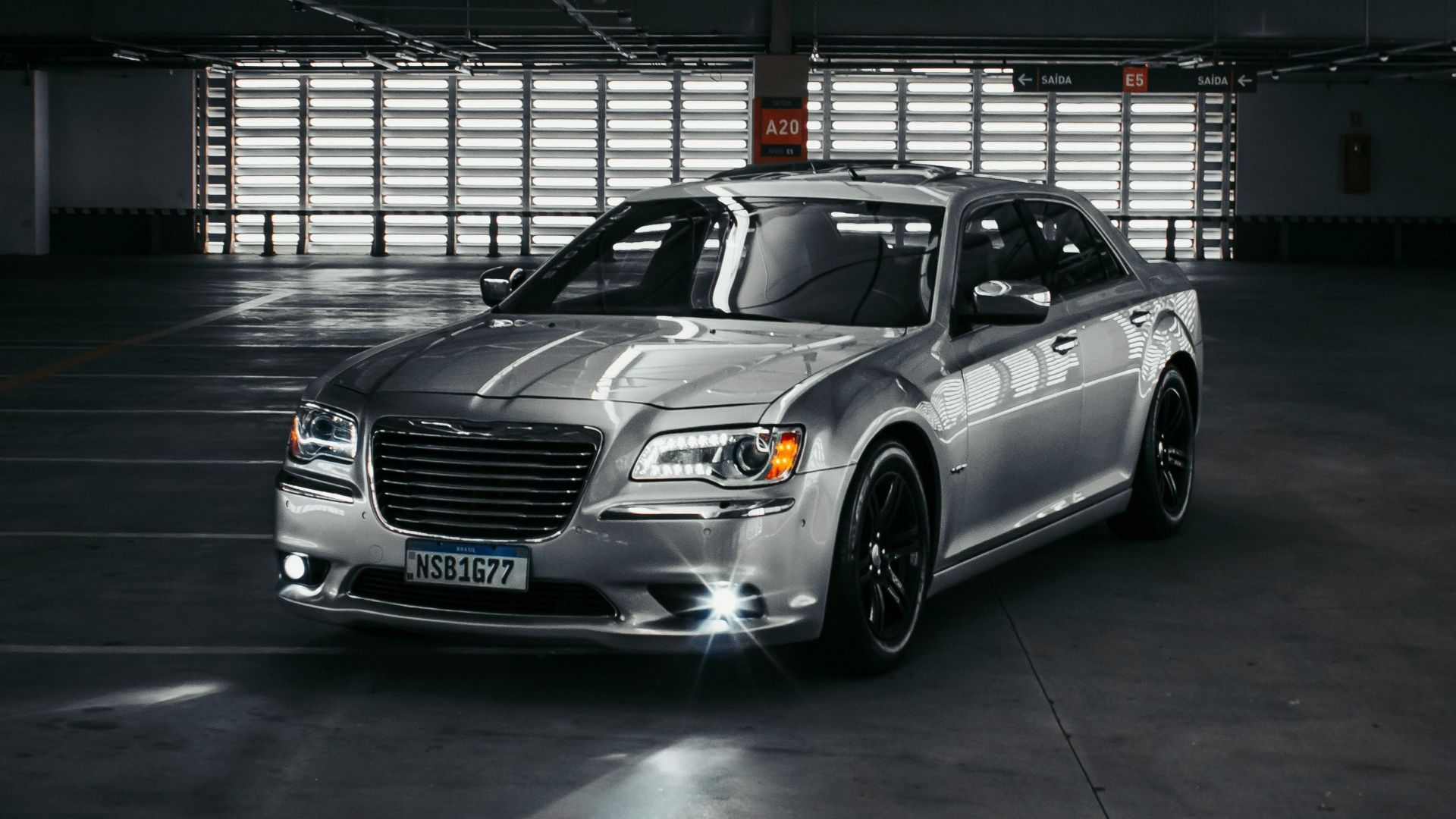 a silver car parked in a parking garage