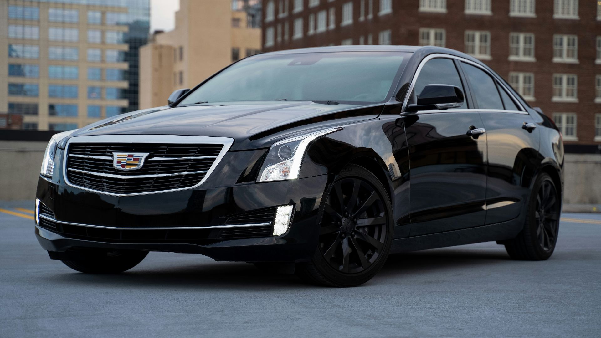 black mercedes benz c class parked on road during daytime