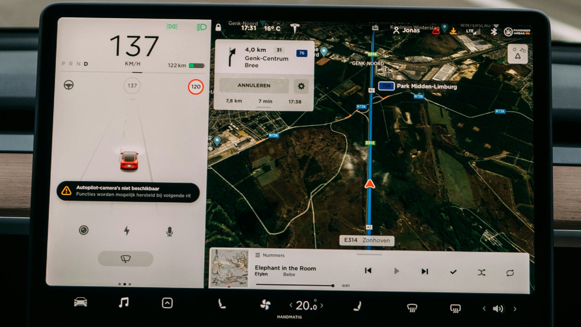 person holding white ipad inside car