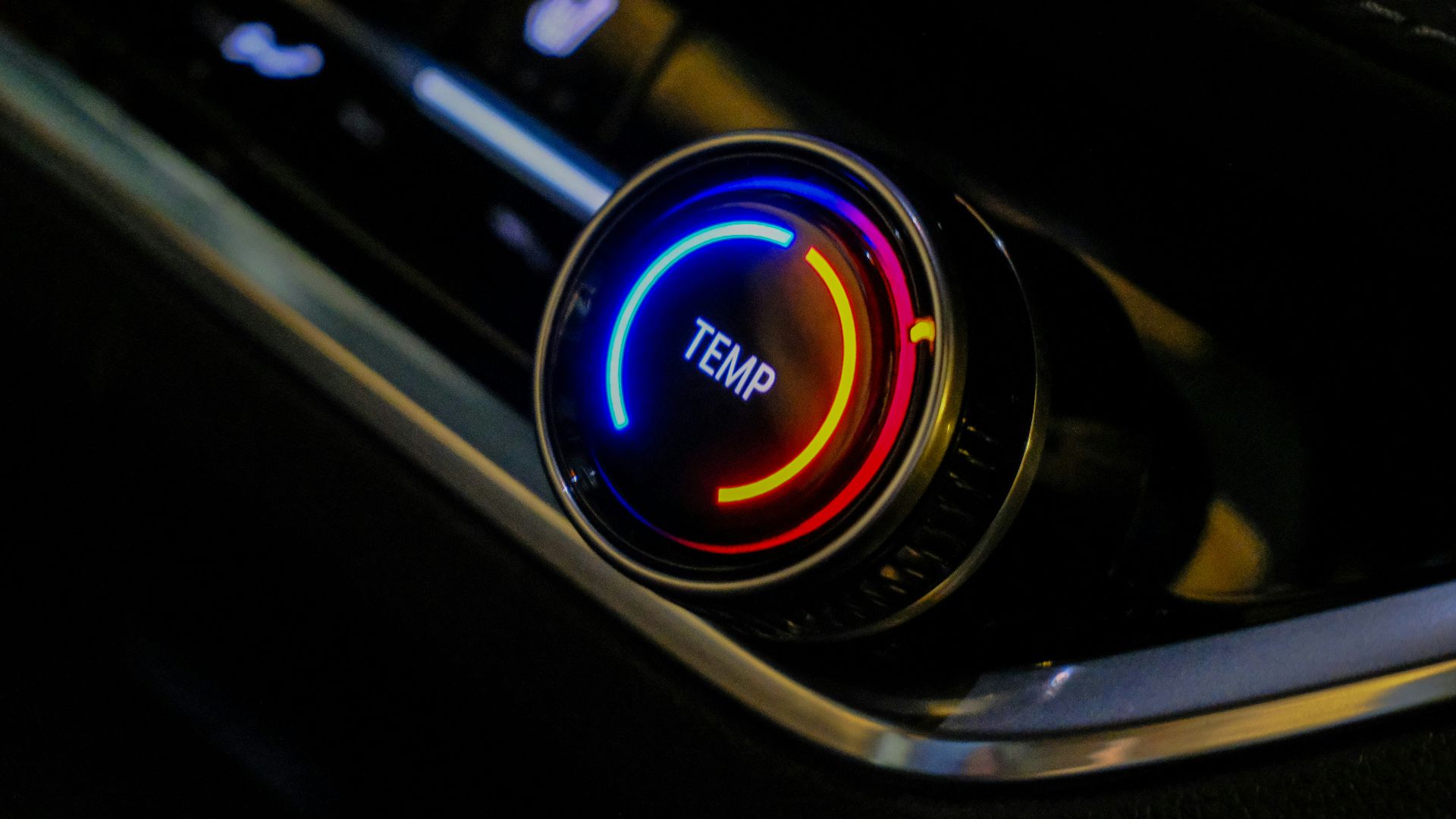 Close-up of a car's temperature control knob.
