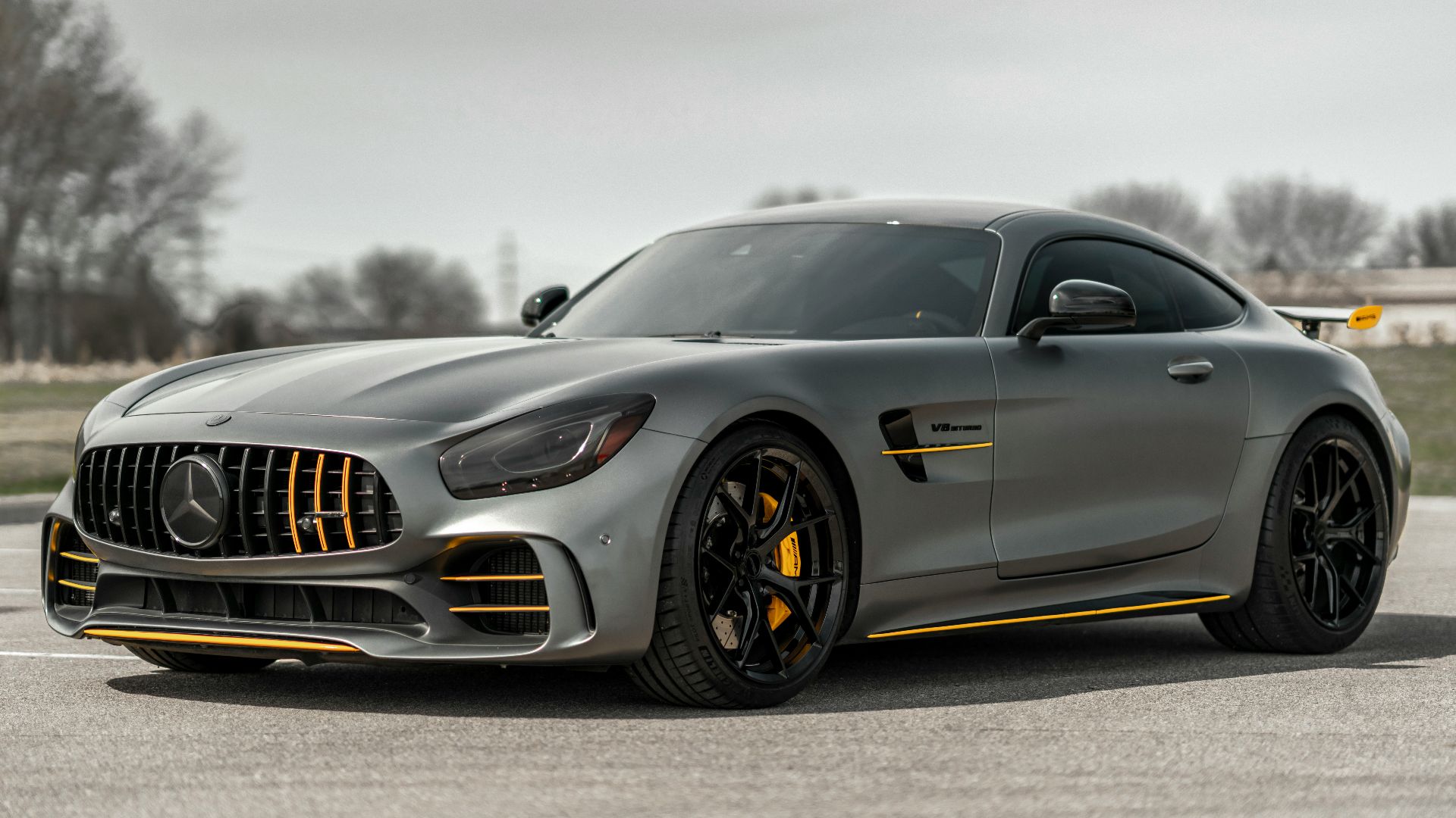 black mercedes benz coupe on gray asphalt road