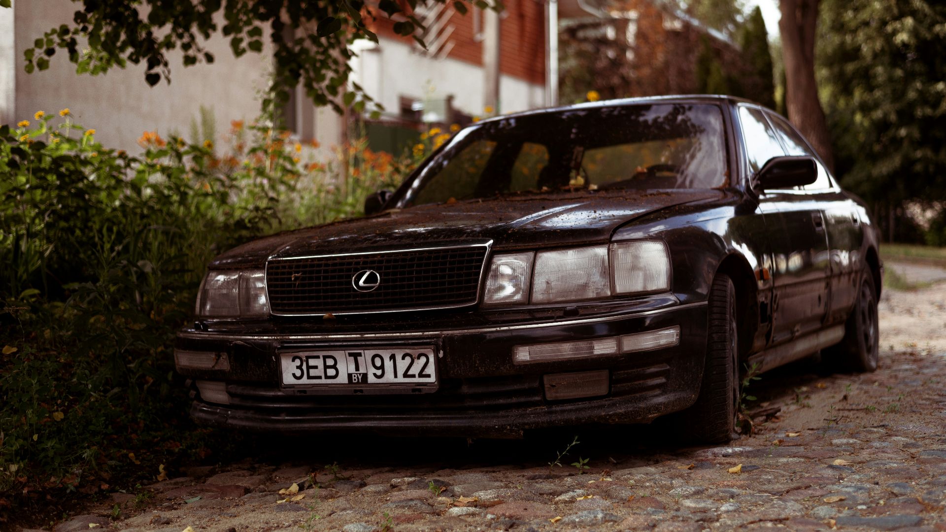 a black car parked on a road